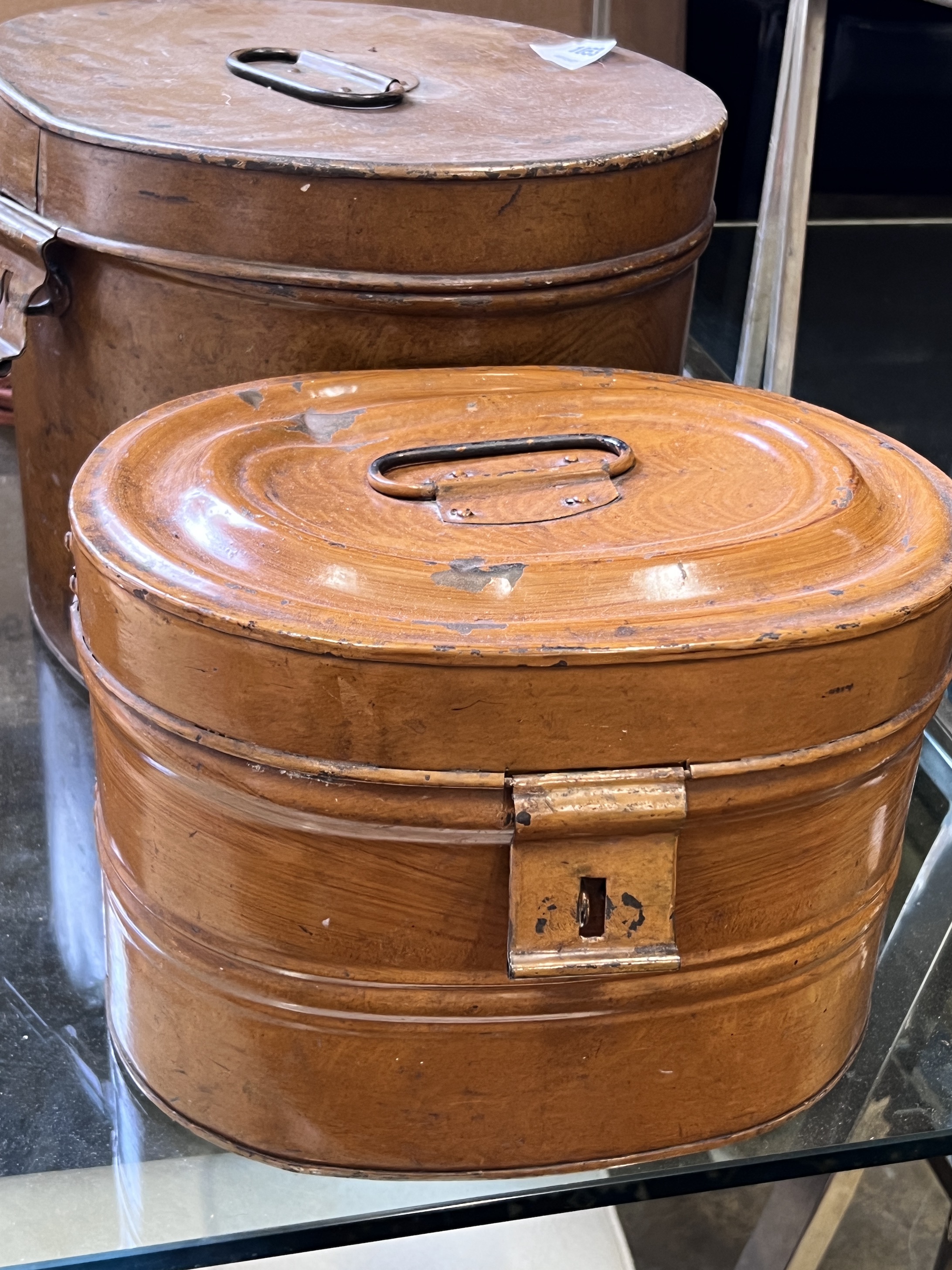 Two Victorian tin hat boxes with simulated grained decoration, largest 40cm